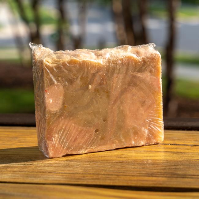 Back of bar in a clear wrapping with visibility of soap.