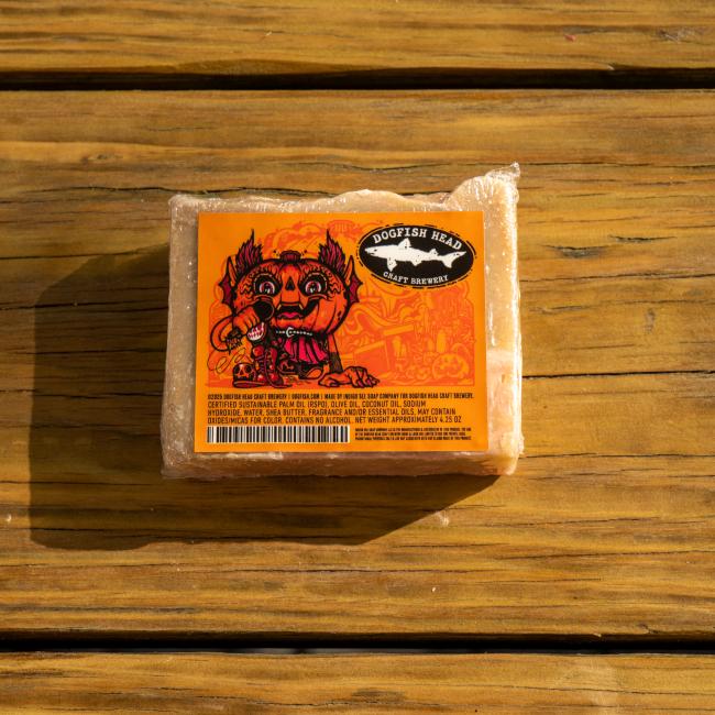 Front view of bar of soap featuring label with Punkin artwork, Dogfish Head shark and shield logo, and ingredients list.
