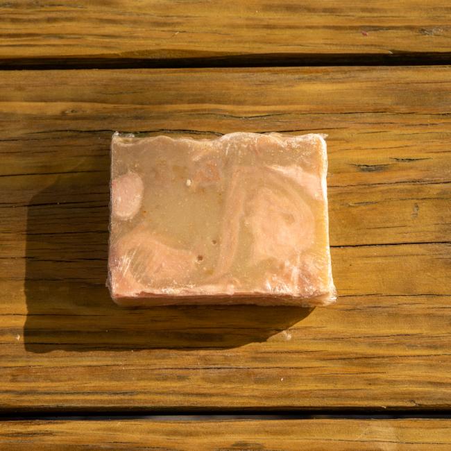 Back of bar in a clear wrapping with visibility of soap.
