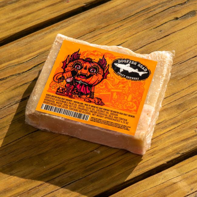 Front view of bar of soap featuring label with Punkin artwork, Dogfish Head shark and shield logo, and ingredients list.