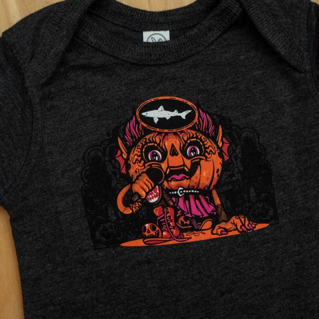 Close-up of front of onesie which features orange Punkin artwork.
