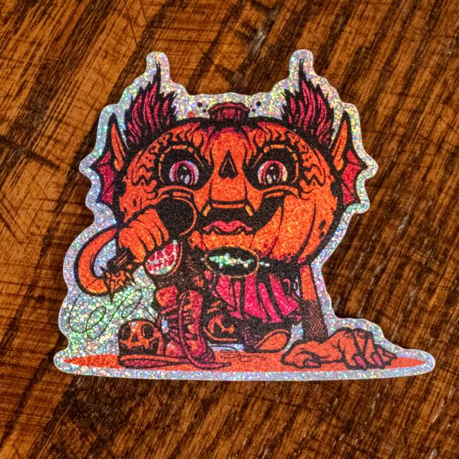 Sticker features orange/red Punkin artwork with a mic in its hand. Sticker is outlined with glitter.