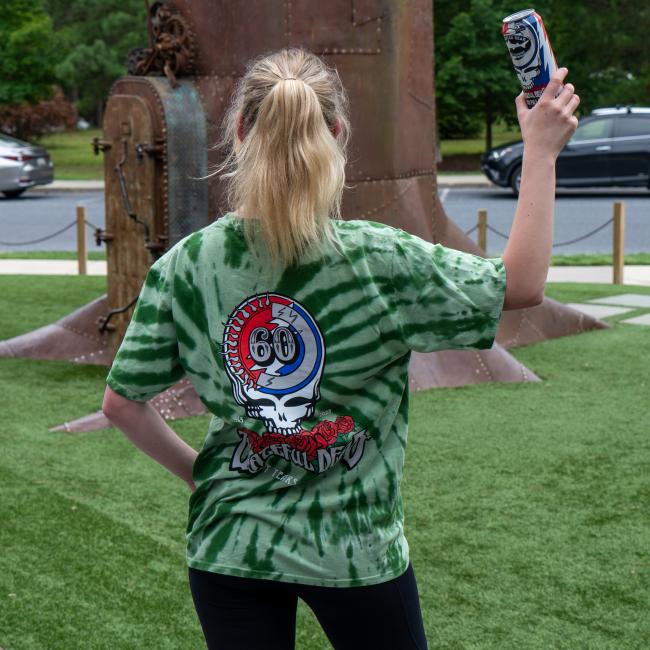 Green tie-dye tee with Dogfish Head logo in the Grateful Dead skull and roses filling back of tee. 