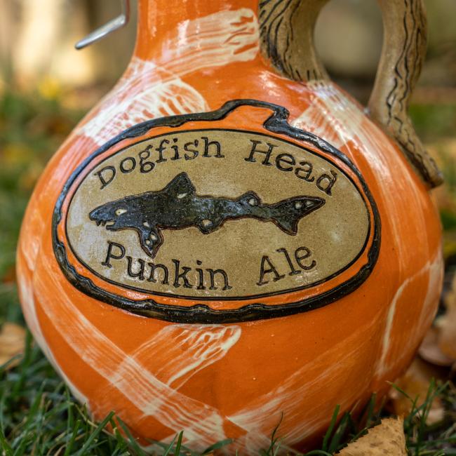 Close-up of logo on the front, Dogfish head logo is centered with writing 